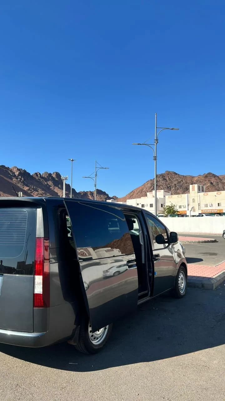 Taxi Bhai private transfer van on the Makkah to Madinah intercity hotel route