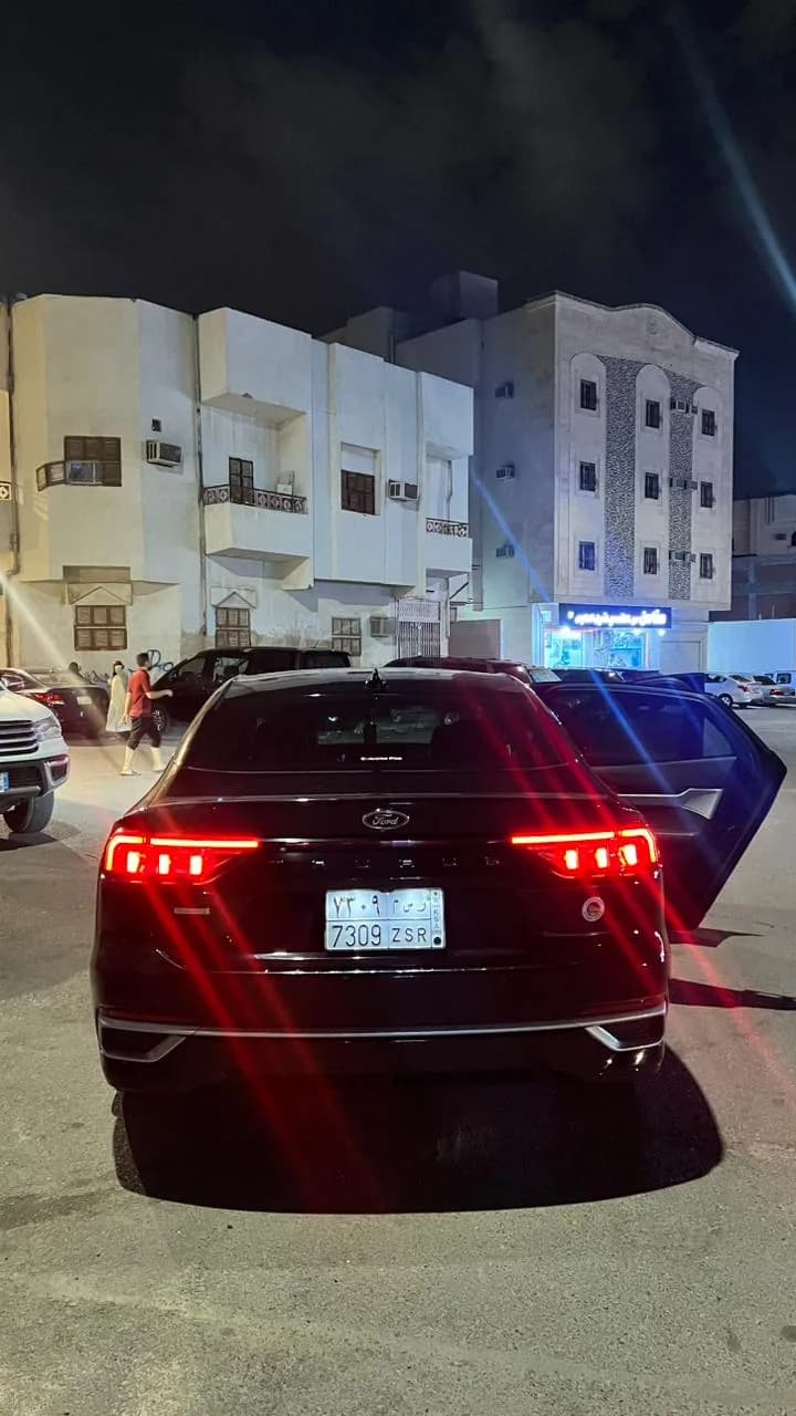 Toyota Camry sedan taxi in Makkah at night